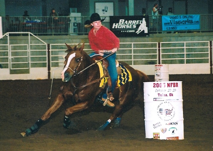 Casie competing in a barrel race with Hershey